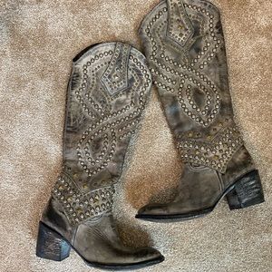 Old Gringo studded knee height boots.